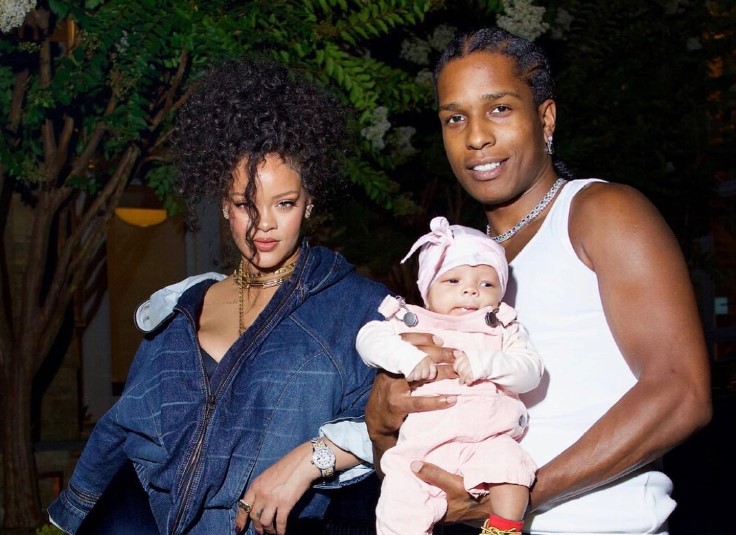 Rihanna and A$AP Rocky pose with their newborn son, Riot Rose.